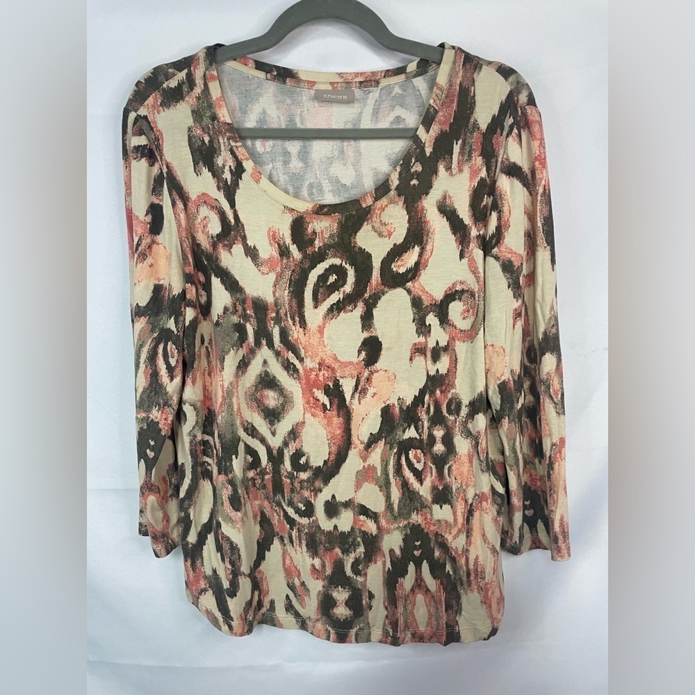 Chicos scoop neck and 3/4 length sleeve, cotton blend and very soft.